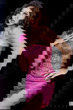 Model wearing Jovani 09483 in hot pink featuring intricate beadwork and high slit.