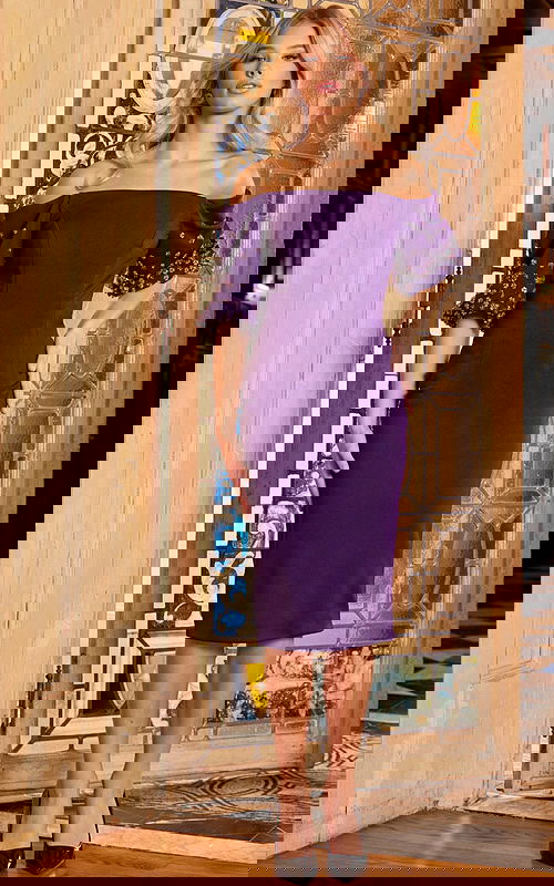 Model wearing Jovani 09517 dress in purple, front view with off-the-shoulder neckline and embellished puff sleeves.