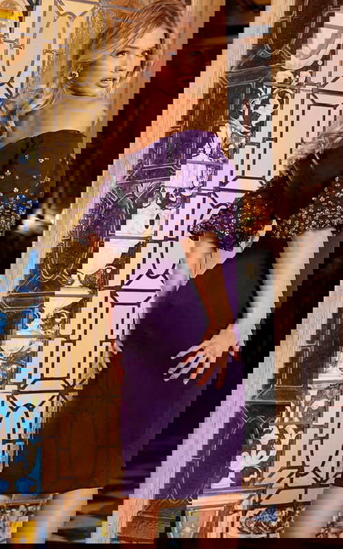 Model wearing Jovani 09517 purple dress, back view showing off-the-shoulder design and silhouette.