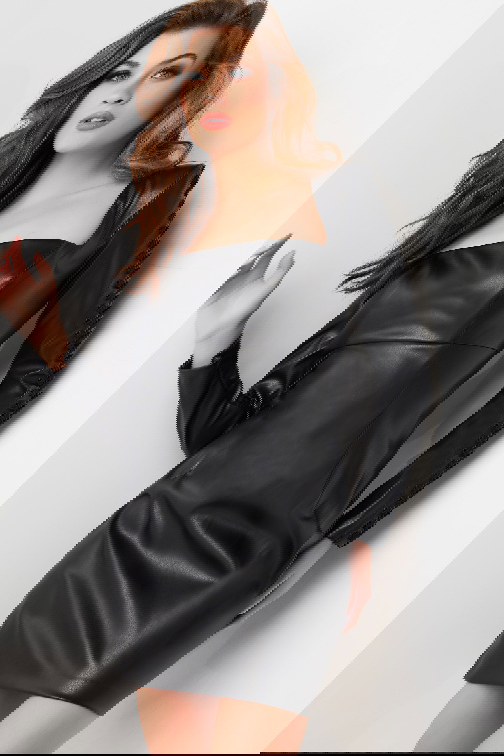 09585-BLACK-22-2.jpg Model wearing Jovani 09585 black mini dress with square neckline and long sleeves, front view.