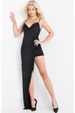 Model wearing Jovani 09593 black dress with asymmetric design and intricate beading, front view.