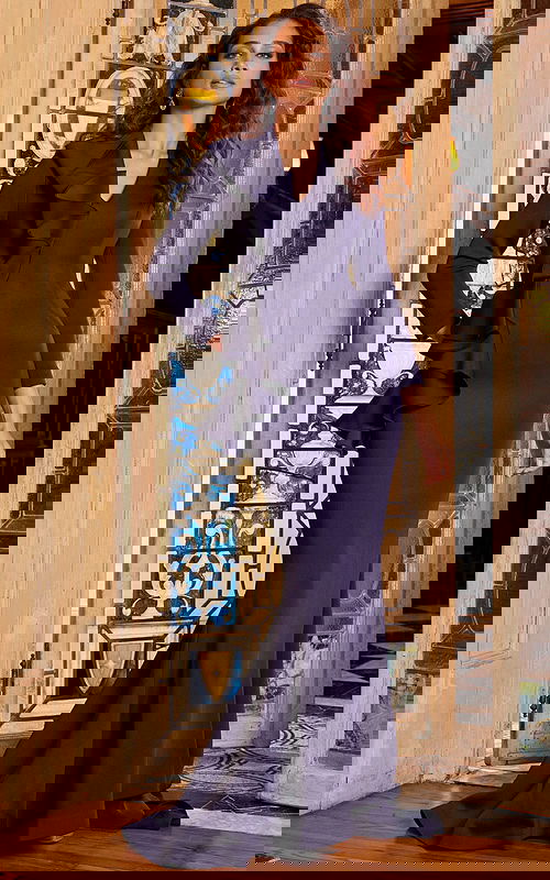 Model wearing Jovani 09597 navy evening gown with mermaid silhouette and ruffle detail.