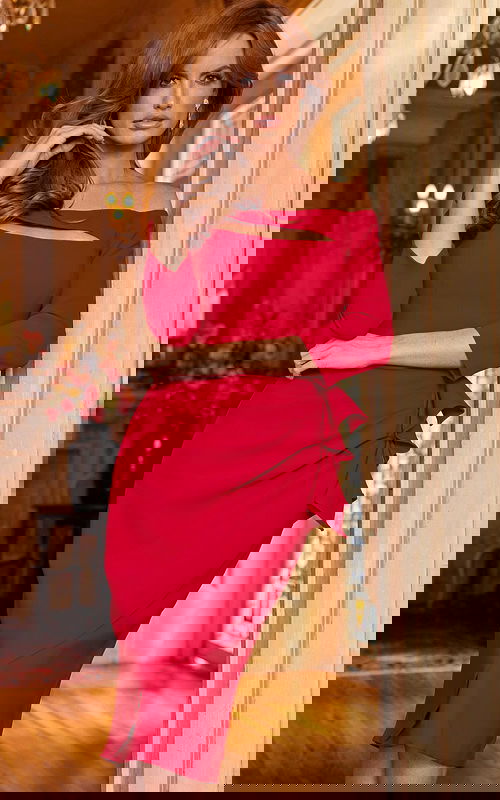 Model wearing Jovani 09624 red dress with a stylish cut-out detail, front view.