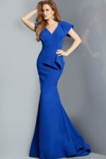 Model wearing Jovani 09644 royal blue dress with V-neckline and peplum detail.