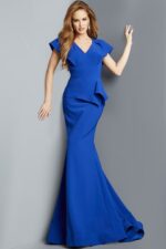Model wearing Jovani 09644 royal blue gown with mermaid silhouette and V-neckline.
