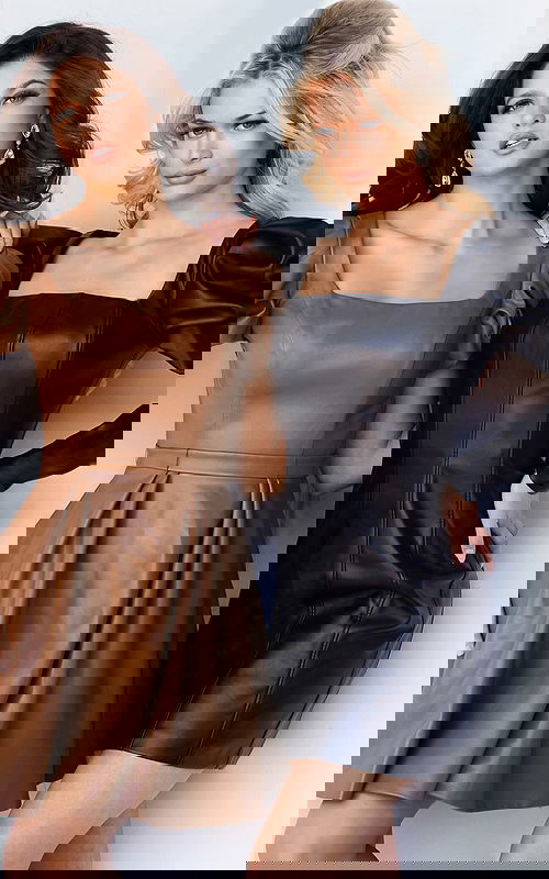 Models wearing Jovani 09690 faux leather dresses with square necklines and puff sleeves in brown and black.