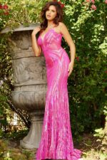 Model wearing Jovani 09693 pink gown with V-neckline and sequin detailing.