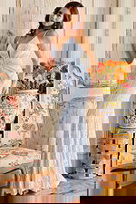 Model wearing Jovani 09693 blue gown, full-length front view with sequins.