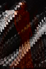 Jovani 09693 gold gown with V-neckline, front view on model.