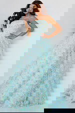 Model wearing K09765, front view of multi-colored A-line gown with strapless neckline and floral patterns.