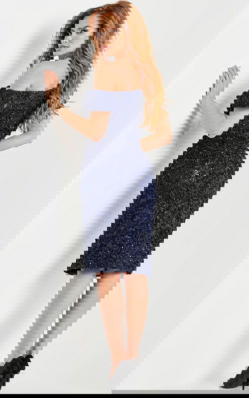 Back view of model in Jovani 09767 navy off-the-shoulder knee-length dress.