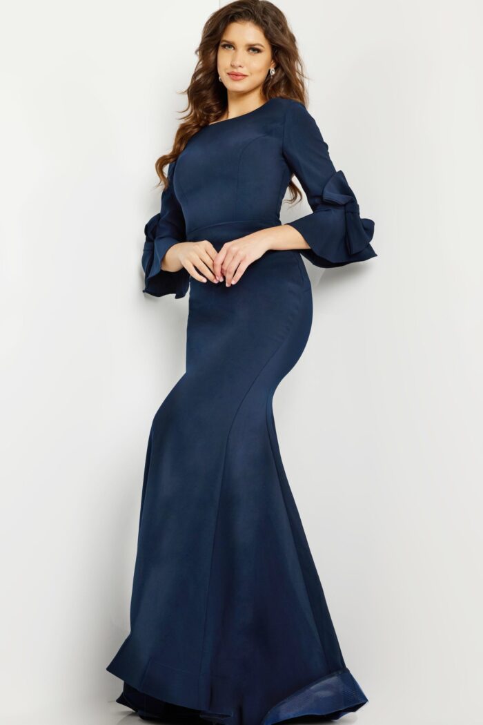 Model wearing Jovani 09776 navy dress, side view.