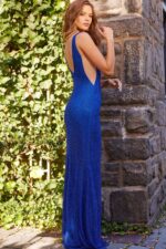 back view of model in Jovani 09891 royal gown with open back design