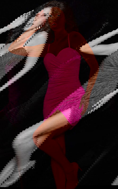 Model wearing Jovani 09914 fuchsia mini dress from front view.