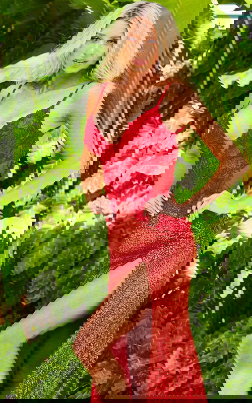 Model wearing Jovani 1012 white dress with high slit, floral details, front view