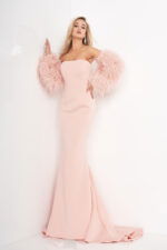 Model wearing Jovani 1226 blush gown with feathered sleeves, front view.