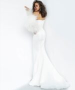 Model wearing Jovani 1226 white gown with feathered sleeves, back view.