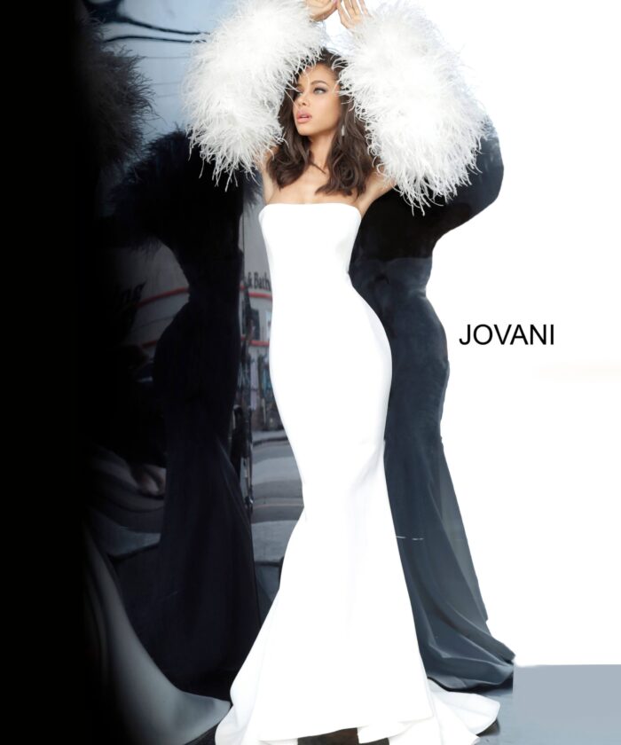 Model wearing Jovani 1226 white gown with feathered sleeves, front view.