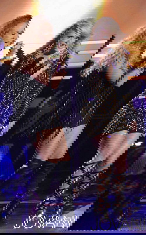 Two models wearing Jovani 6528 black and gold mini dress