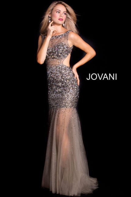 Model wearing Jovani 171100 gown with shimmering embellishments and sheer skirt in champagne color.