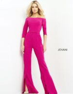 Model in Jovani 1867 fuchsia jumpsuit standing with hands at sides