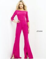 Model wearing Jovani 1867 fuchsia jumpsuit, posing with hand on hip