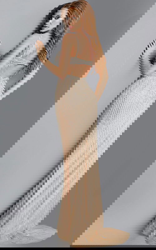 Model wearing Jovani 2129 nude gown with open back and sequin detailing, back view.