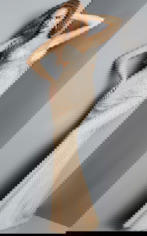 Model wearing Jovani 2129 nude gown with sweetheart neckline and sequins, front view.