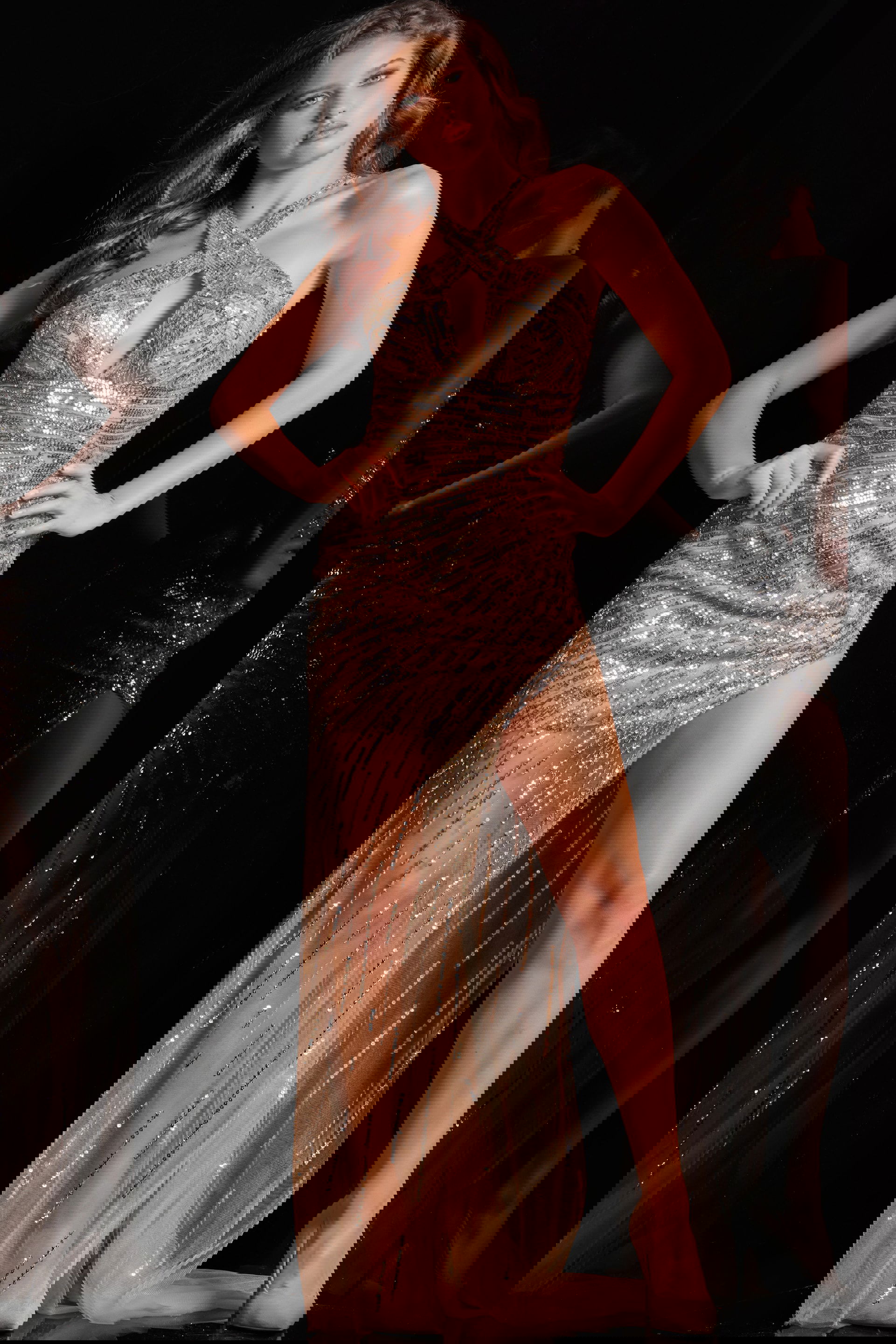 220130_3.jpg Model wearing Jovani 220130 nude dress with criss-cross halter neckline and sequin details, front view.