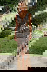 Beaded illusion bridal gown with deep V neckline and fitted silhouette