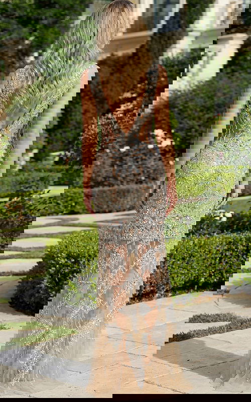 Back view of beaded bridal gown with sheer skirt and geometric embellishments