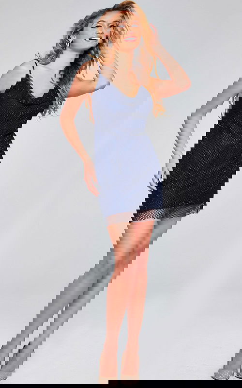 Model wearing Jovani 22295 navy dress with cowl neckline and mesh overlay, front view.