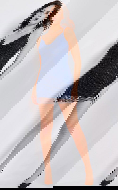 Model wearing Jovani 22295 navy mini dress with cowl neckline and mesh hem.