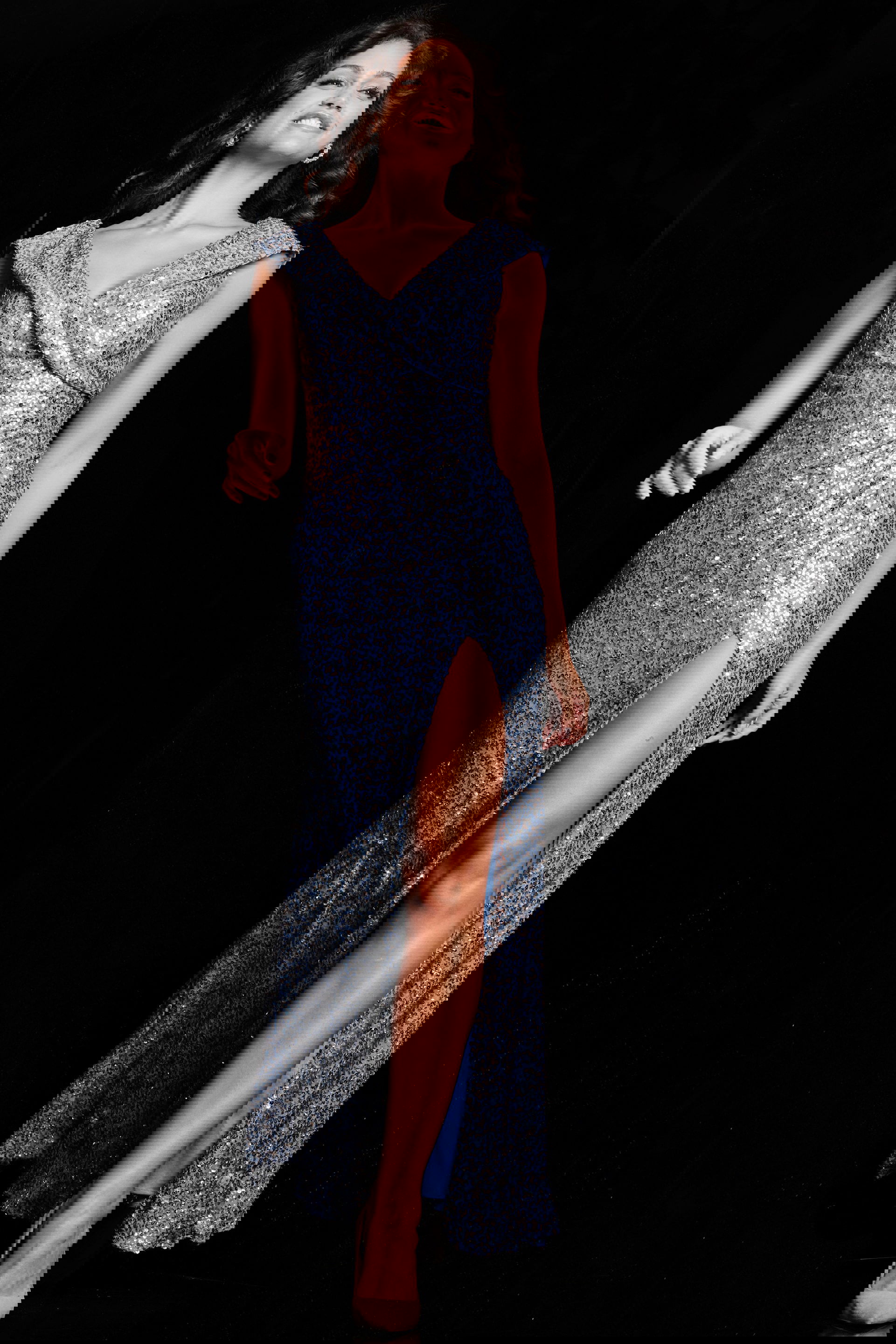 22336_PERRIWINKLE_2017.jpg Model wearing Jovani 22336 blue gown with V-neckline and high slit from the front view.