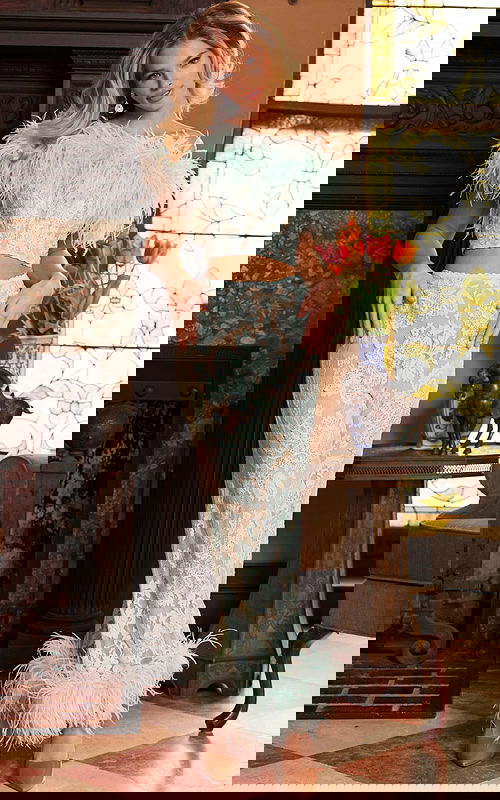 Model wearing Jovani 22350 with a front view showcasing the off-shoulder feathered neckline and lace detail.