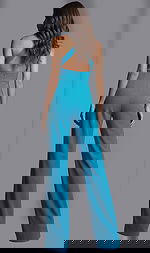 Back view of halter neck jumpsuit with open back, fitted waist, and wide leg design