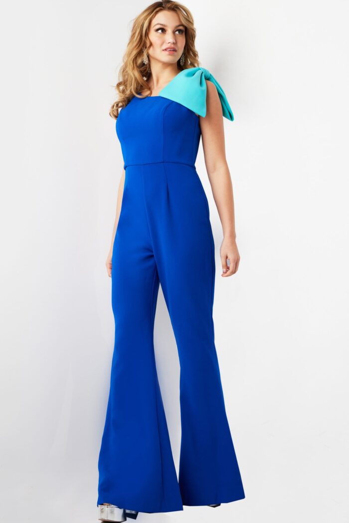 Jovani 22589 royal blue jumpsuit with bow detail, front view from angle.