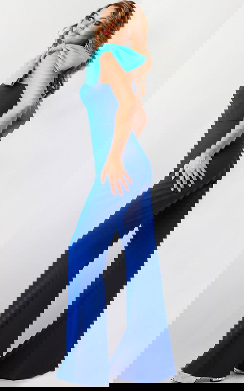 Model showing back of Jovani 22589 royal blue jumpsuit.