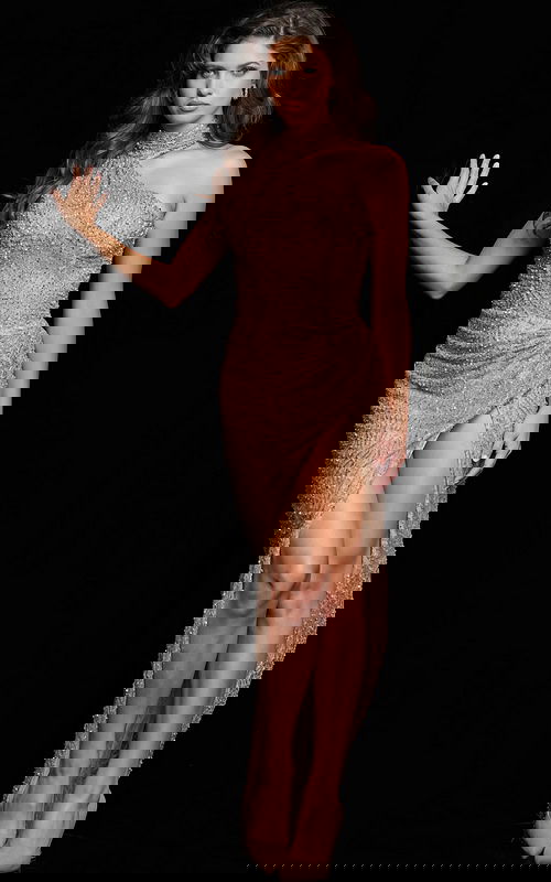 Model wearing Jovani 22849 gold gown with high neckline and side slit.