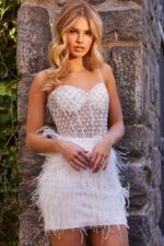 Model showcasing Jovani 22913 design in white, with intricate beadwork and feather details.