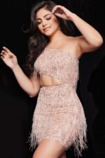 Model wearing Jovani 22940 blush mini dress with front cut-out and fringe, front view