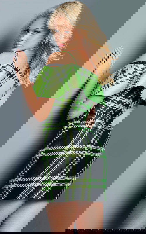 model wearing Jovani 23003 green plaid mini dress, back view