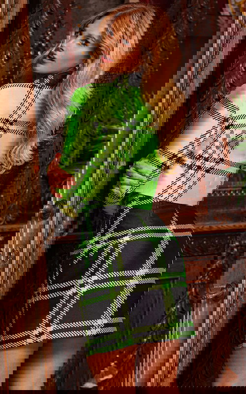 Model wearing Jovani 23004 green plaid mini dress, back view.