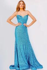 Model wearing 23077 blue sequin gown, full length front view