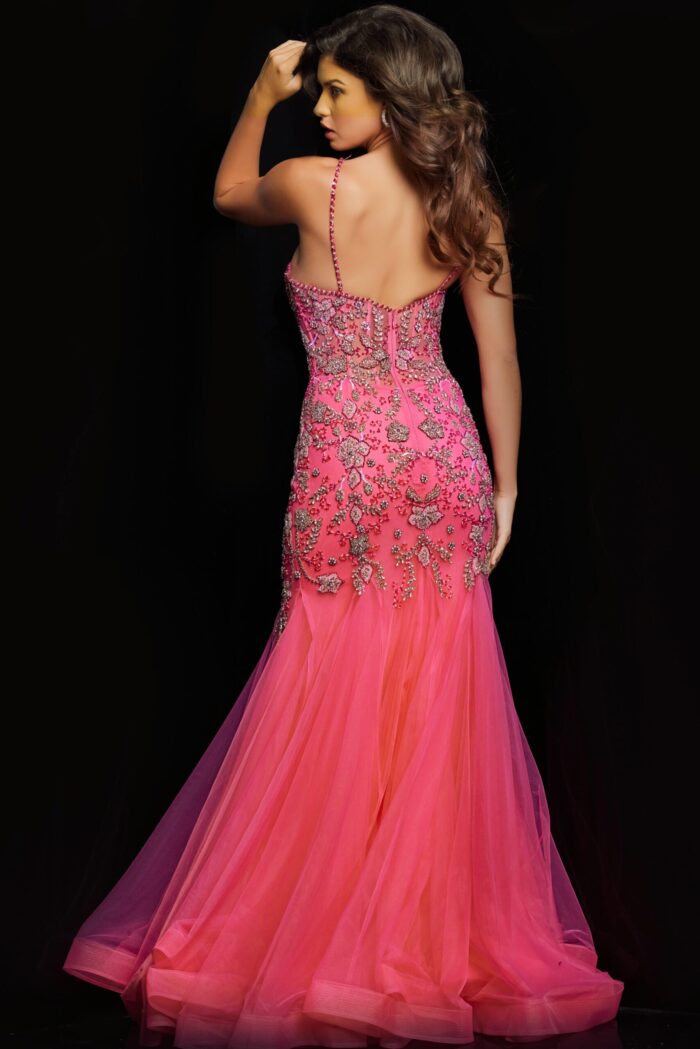 Back view of model in Jovani 23125 highlighting open back and pink tulle mermaid silhouette