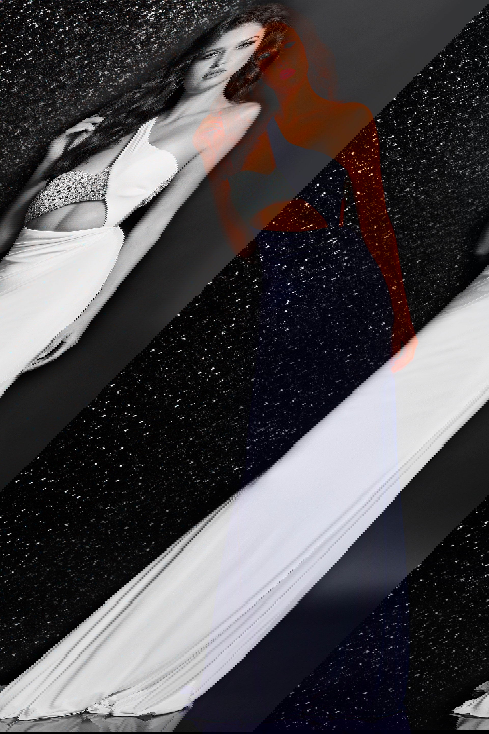 23130-20jersey.jpg Model wearing Jovani 23130 white one-shoulder gown with embellished bodice, front view.