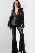Model wearing Jovani 23162 black sequin outfit showing V-neckline