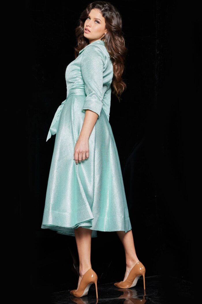 model wearing 23176 mint dress with V-neckline and three-quarter sleeves, back view