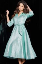 model wearing 23176 mint dress with V-neckline and three-quarter sleeves, front view