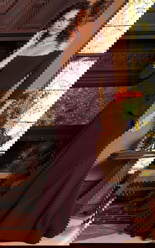 model wearing Jovani 23190 purple dress with off-shoulder neckline and three-quarter sleeves